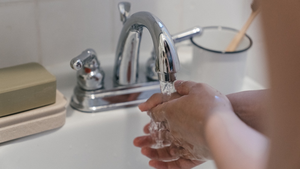 hand-washing in sink